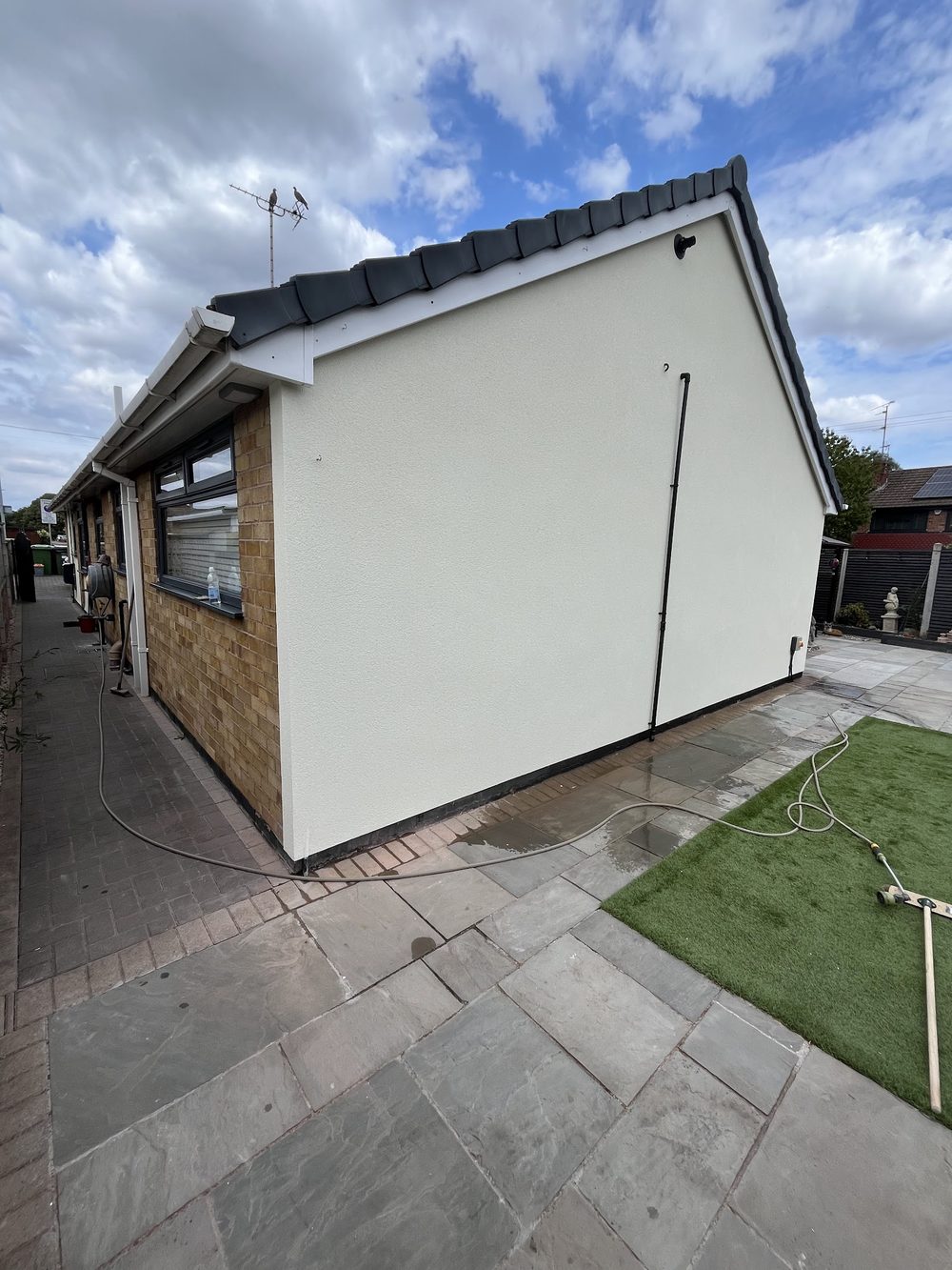 Side wall of a bungalow rendered white